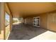 Covered patio features concrete flooring and provides access to the home via a set of glass patio doors at 2090 S Ambush St, Pahrump, NV 89048