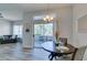 Kitchen and dining area with sliding door to deck, wood cabinets, stainless appliances and modern lighting at 2305 W Horizon Ridge Pkwy # 3713, Henderson, NV 89052