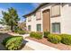 Two-story condo with appealing exterior, staircase entry, and manicured landscaping at 2305 W Horizon Ridge Pkwy # 3713, Henderson, NV 89052