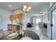 Open-concept kitchen featuring wood cabinets, stainless steel appliances, and a dining area, blending style and functionality at 2305 W Horizon Ridge Pkwy # 3713, Henderson, NV 89052