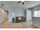 Relaxing living room with wood-look tile floors, neutral walls, and access to hallway and entry at 2305 W Horizon Ridge Pkwy # 3713, Henderson, NV 89052