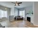 Spacious living room featuring modern decor, wood-look floors, and a fireplace at 2305 W Horizon Ridge Pkwy # 3713, Henderson, NV 89052
