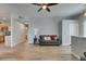 Bright living room features wood-look tile flooring and flows into the kitchen with stainless appliances at 2305 W Horizon Ridge Pkwy # 3713, Henderson, NV 89052