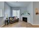 Inviting living room with a corner fireplace, stylish decor, and wood-look flooring at 2305 W Horizon Ridge Pkwy # 3713, Henderson, NV 89052