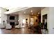 Community lounge with a fireplace and views into the dining room and kitchen at 2305 W Horizon Ridge Pkwy # 3713, Henderson, NV 89052