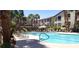 Resort-style pool with ample lounge seating and lush landscaping at this condo community at 2305 W Horizon Ridge Pkwy # 3713, Henderson, NV 89052