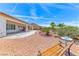 Backyard featuring desert landscaping, covered patio, and beautiful exterior at 2377 Baldwinville Ct, Henderson, NV 89044