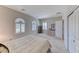 Cozy bedroom features neutral carpet, large windows with coverings, and a closet for ample storage at 2377 Baldwinville Ct, Henderson, NV 89044