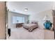Bright bedroom features a large window, comfortable bed, and ample space at 2377 Baldwinville Ct, Henderson, NV 89044