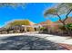 Inviting clubhouse entrance with well-manicured landscaping and modern architectural design at 2377 Baldwinville Ct, Henderson, NV 89044