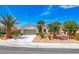 Charming single-story home with desert landscaping and beautiful palm trees in a sunny neighborhood at 2377 Baldwinville Ct, Henderson, NV 89044