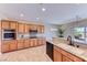 Modern kitchen boasts stainless steel appliances, granite counters and recessed lighting at 2377 Baldwinville Ct, Henderson, NV 89044