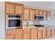 Modern kitchen boasts stainless steel appliances, granite counters and recessed lighting at 2377 Baldwinville Ct, Henderson, NV 89044
