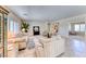 Spacious living room with large windows, comfortable seating, and neutral decor at 2377 Baldwinville Ct, Henderson, NV 89044