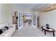 Comfortable home office showcases glass french doors, a neutral color palette, and ample lighting at 2377 Baldwinville Ct, Henderson, NV 89044