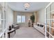Inviting home office with glass french doors, large window, and comfortable seating at 2377 Baldwinville Ct, Henderson, NV 89044