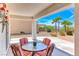 Covered patio with a seating area perfect for enjoying the beautiful outdoor views at 2377 Baldwinville Ct, Henderson, NV 89044