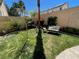 A cozy backyard space featuring green grass, comfortable seating, and a peaceful atmosphere at 2559 Purple Heather Pl, Henderson, NV 89052