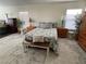 Cozy bedroom with a queen bed, neutral bedding, and natural light from two windows at 2559 Purple Heather Pl, Henderson, NV 89052