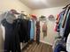 Well-organized walk-in closet with hardwood floors and ample shelving at 2559 Purple Heather Pl, Henderson, NV 89052