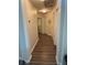 Hallway with neutral paint and trim and wood-look floors at 2559 Purple Heather Pl, Henderson, NV 89052