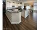 Spacious kitchen with white cabinets, granite countertops, and stainless steel appliances at 2559 Purple Heather Pl, Henderson, NV 89052