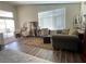 Bright living room with comfortable seating, a sliding glass door to the backyard at 2559 Purple Heather Pl, Henderson, NV 89052