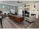 Inviting living room with a cozy fireplace, large windows, and stylish decor at 2559 Purple Heather Pl, Henderson, NV 89052