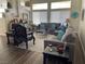 Open living room features plush seating, large windows, and stylish decor at 2559 Purple Heather Pl, Henderson, NV 89052
