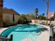 Relaxing backyard pool with a spa, surrounded by lush greenery and a private setting at 2559 Purple Heather Pl, Henderson, NV 89052