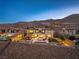 Luxury home with a sparkling pool, manicured backyard, and beautiful desert landscape at 26 Olympia Outlook Dr, Las Vegas, NV 89141