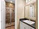 Modern bathroom featuring a glass-enclosed shower with decorative tile and a sleek vanity at 26 Olympia Outlook Dr, Las Vegas, NV 89141