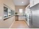 Bright kitchen with modern appliances, white cabinetry, and ample counter space, perfect for cooking and entertaining at 26 Olympia Outlook Dr, Las Vegas, NV 89141