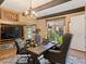 Comfortable home office with wood beams, custom built-in shelves, and decorative Western-themed decor at 26 Olympia Outlook Dr, Las Vegas, NV 89141