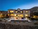 Stunning backyard featuring a sparkling pool, covered patio, and beautifully landscaped grounds at 26 Olympia Outlook Dr, Las Vegas, NV 89141