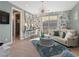 Sitting room boasts floral wallpaper, chandelier, view, desk, and comfortable seating at 26 Olympia Outlook Dr, Las Vegas, NV 89141