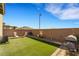 Spacious backyard with artificial turf, a privacy wall, and space for outdoor activities at 2849 Mincio St, Henderson, NV 89044