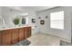 Bright bathroom features a dual-sink vanity and decorative towel racks at 2849 Mincio St, Henderson, NV 89044