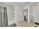 Bright bathroom featuring a shower/tub combo with gray curtain and a tile floor at 2849 Mincio St, Henderson, NV 89044