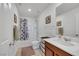 Bathroom with a shower-tub combo and a wood vanity at 2849 Mincio St, Henderson, NV 89044