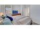 Comfortable bedroom with a large window and flatscreen TV atop a wooden dresser at 2849 Mincio St, Henderson, NV 89044
