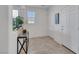 Bright and airy entryway featuring tiled floors, coat closet, and modern decor at 2849 Mincio St, Henderson, NV 89044