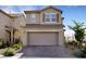 Charming two-story home featuring a tiled roof, two-car garage, and well-maintained landscaping at 2849 Mincio St, Henderson, NV 89044
