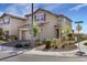 Street view of a two-story home with neutral color, a tiled roof, and curb appeal from corner lot at 2849 Mincio St, Henderson, NV 89044