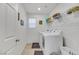 Laundry room with washer, dryer, and shelving for storage at 2849 Mincio St, Henderson, NV 89044