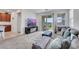The cozy living room offers comfortable seating, a fireplace, and access to a patio for seamless indoor-outdoor living at 2849 Mincio St, Henderson, NV 89044