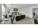 Spacious main bedroom with a desk area and a luxurious queen-sized bed, well-lit by windows at 2849 Mincio St, Henderson, NV 89044