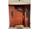 Detailed view of the front door highlighting decorative glass inserts and classic design at 2857 Queens Courtyard Dr, Las Vegas, NV 89109