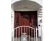 Elegant front door with glass inserts, welcoming design, and white iron gate at 2857 Queens Courtyard Dr, Las Vegas, NV 89109