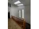 Elegant stairway featuring a skylight, and stylish chandelier at 2857 Queens Courtyard Dr, Las Vegas, NV 89109